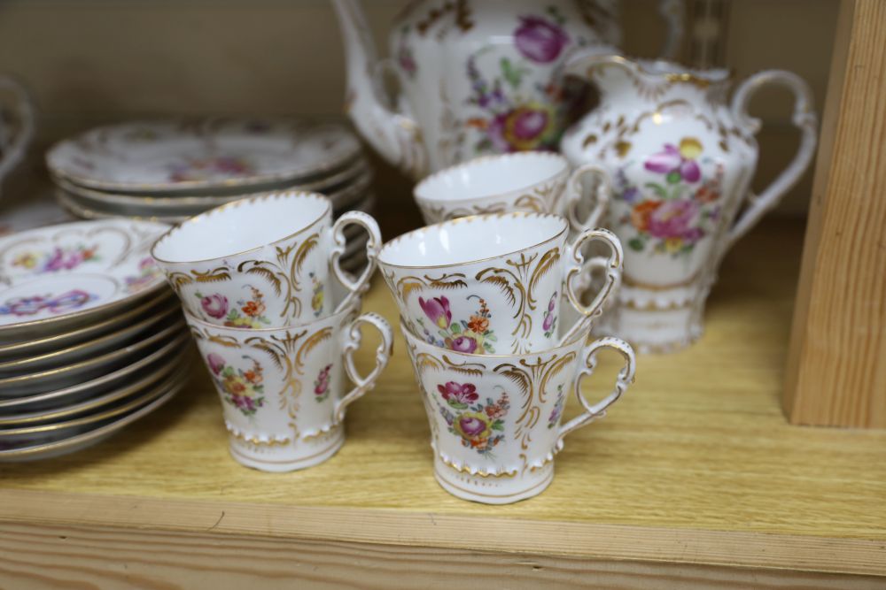 A 19th century Continental 29 piece gilt and floral coffee set, monogrammed, coffee pot 26cm